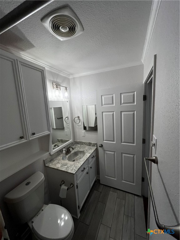 151 Mockingbird Lane Lampasas, TX 76550 - Photo 11 of 22 a bathroom with a granite countertop toilet sink and mirror