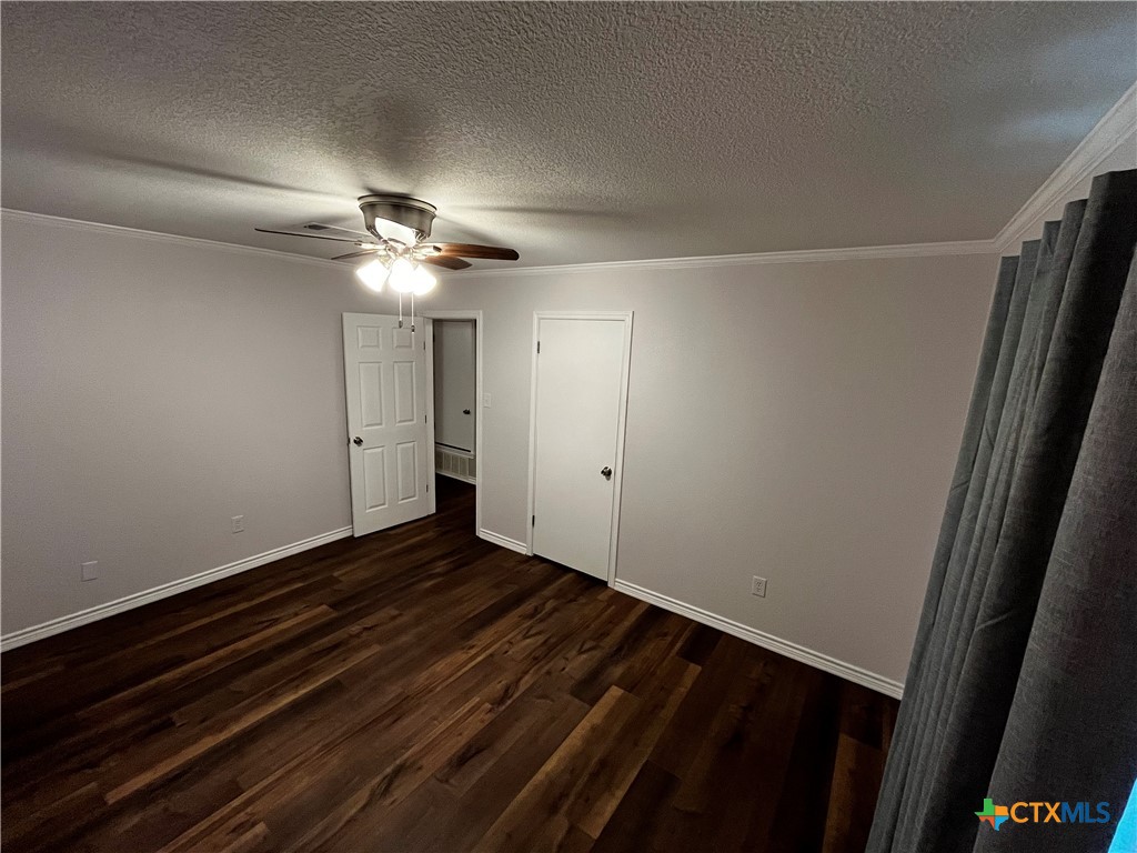 151 Mockingbird Lane Lampasas, TX 76550 - Photo 12 of 22 a view of an empty room with wooden floor
