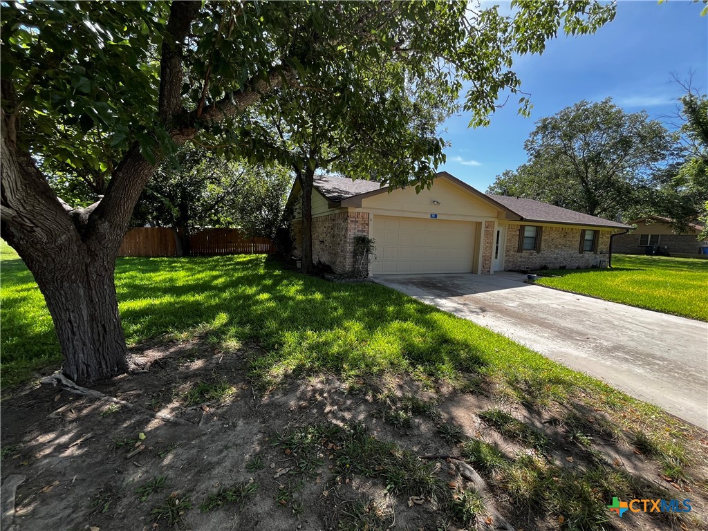 151 Mockingbird Lane Lampasas, TX 76550 - Photo 3 of 22 a white house that has a tree in front of it