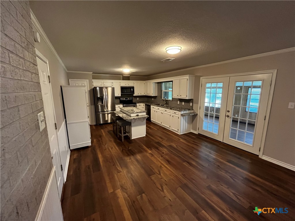 151 Mockingbird Lane Lampasas, TX 76550 - Photo 5 of 22 a view of a living room with furniture and wooden floor
