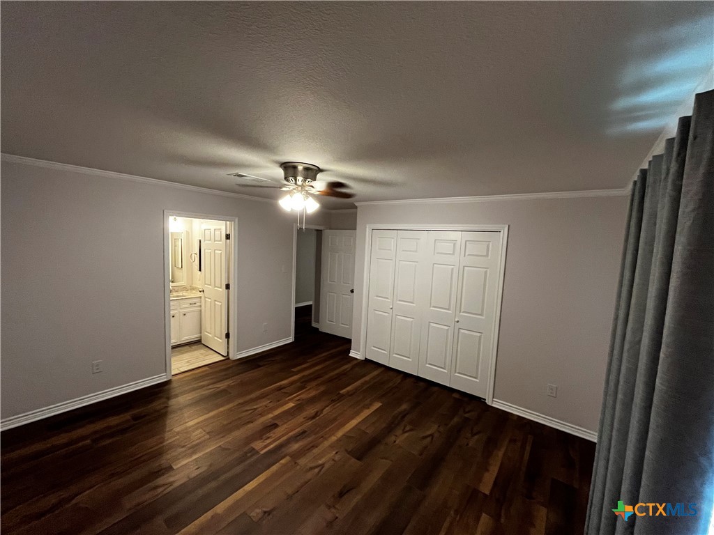 151 Mockingbird Lane Lampasas, TX 76550 - Photo 9 of 22 a view of an empty room with wooden floor and a window