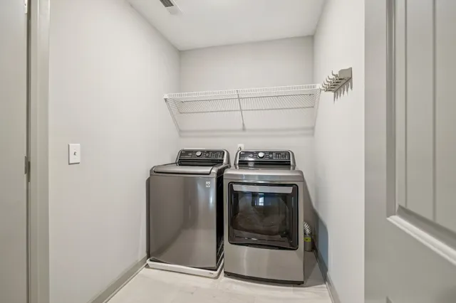 a utility room with washer and dryer