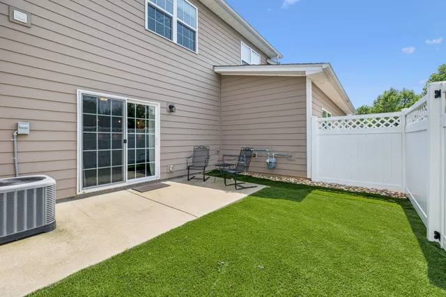 a backyard of a house with seating space
