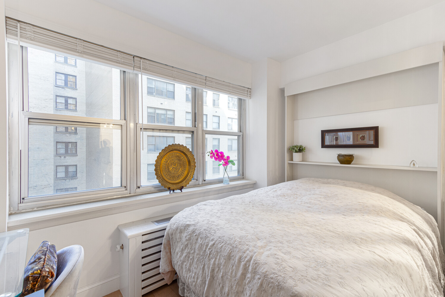 80 Park Avenue, Unit 6A Manhattan, NY 10016 - Photo 3 of 7 a bedroom with a bed and a large window
