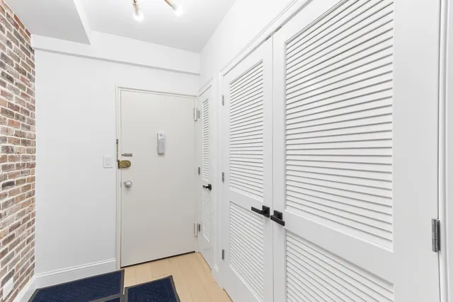 a bathroom with a sink vanity granite and shower