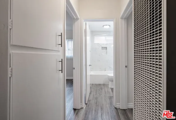 a bathroom with a glass shower door