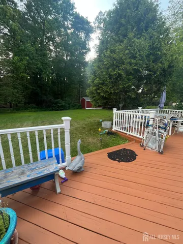a view of a wooden deck with a bench