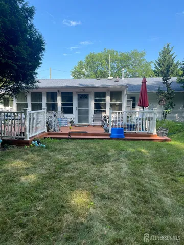 front view of a house with a yard table and chairs