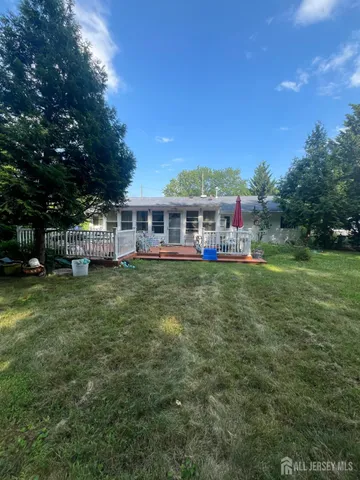 a view of a house with a big yard