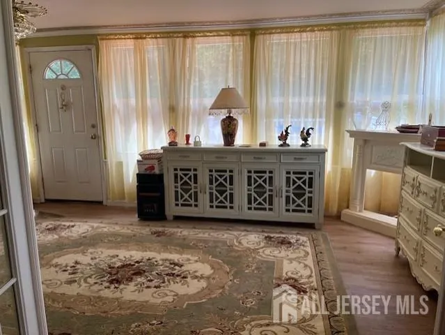 a view of a room with furniture and window