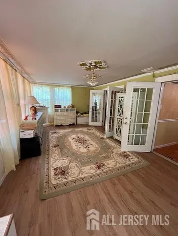 a view of a livingroom with wooden floor