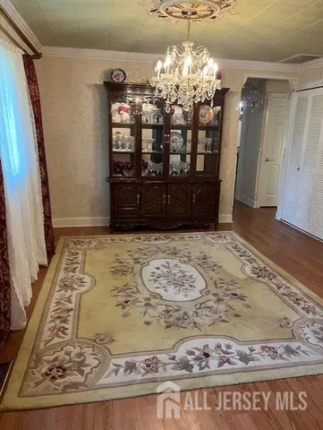 a view of a living room with wooden floor