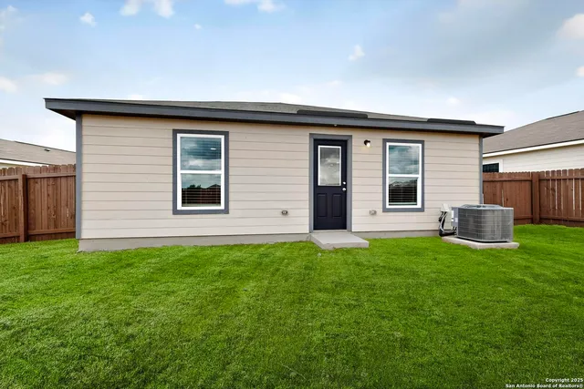 a backyard of a house with seating space