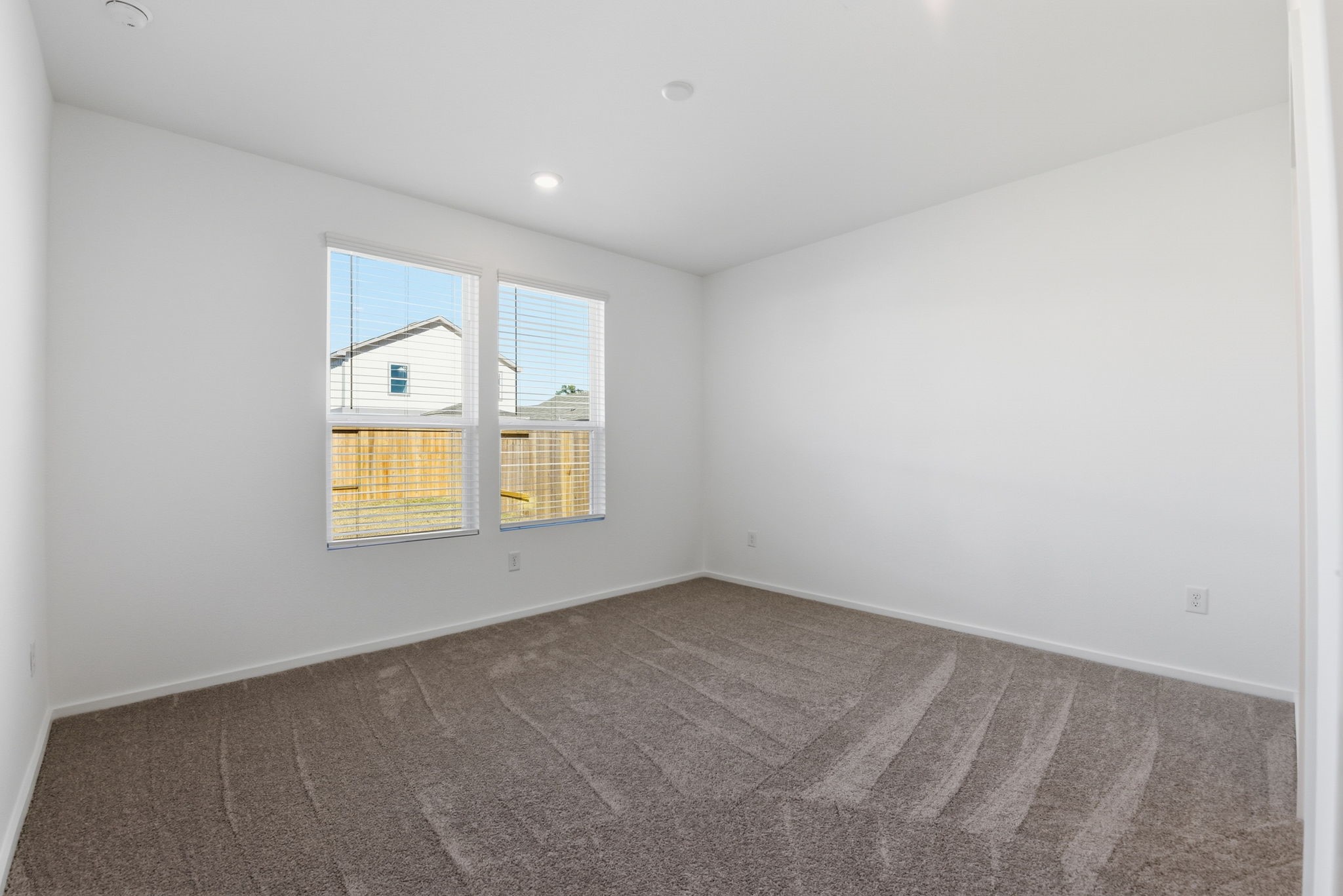 26283 Arrowleaf Drive Magnolia, TX 77355 - Photo 17 of 34 a view of an empty room with a window and dresser