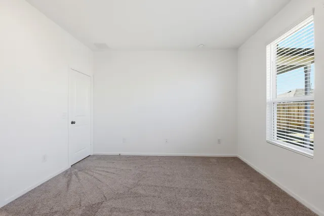 a view of a room that has a window in it