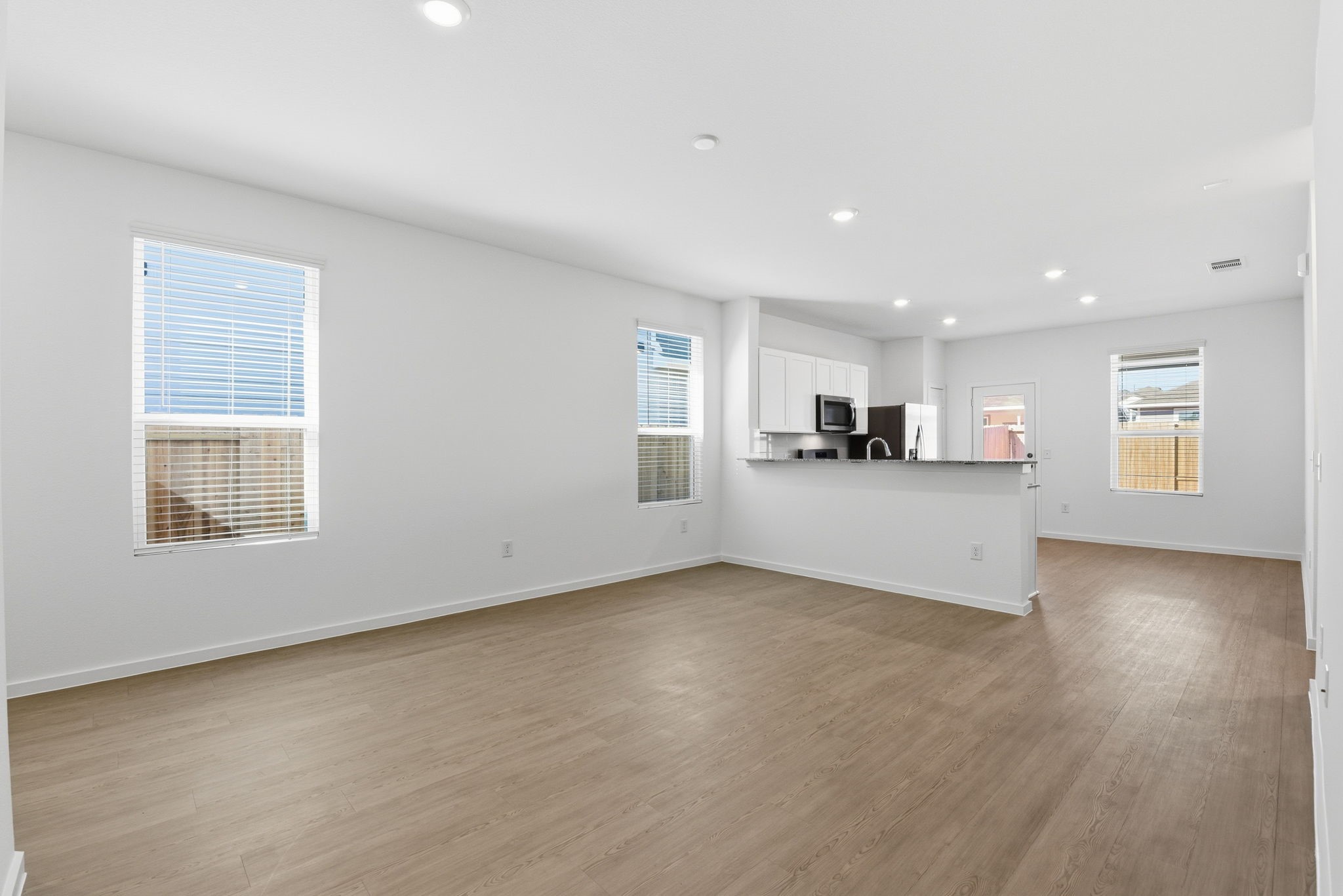 26283 Arrowleaf Drive Magnolia, TX 77355 - Photo 8 of 34 a view of a kitchen with a sink cabinets and a window