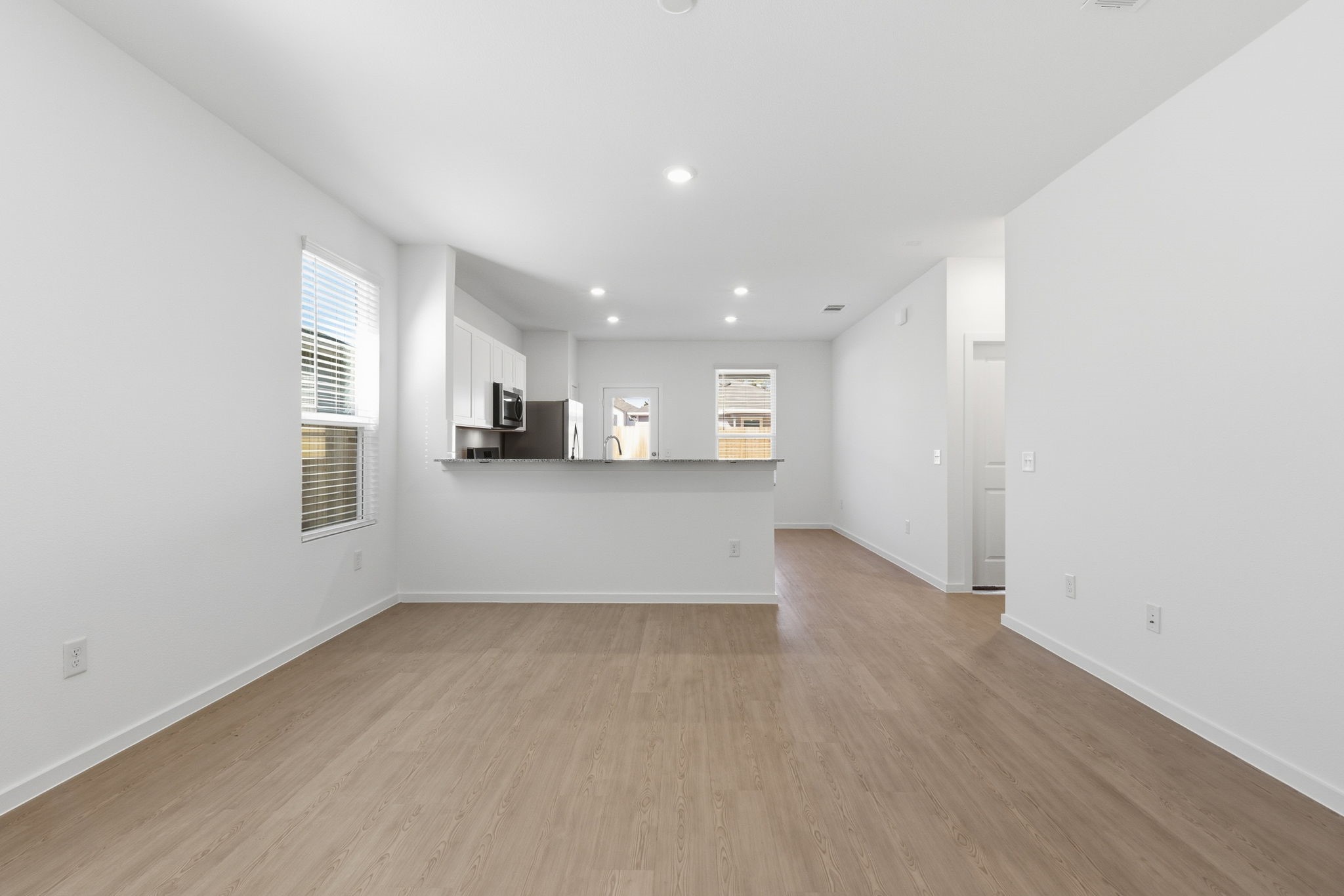 26283 Arrowleaf Drive Magnolia, TX 77355 - Photo 10 of 34 an empty room with wooden floor and windows
