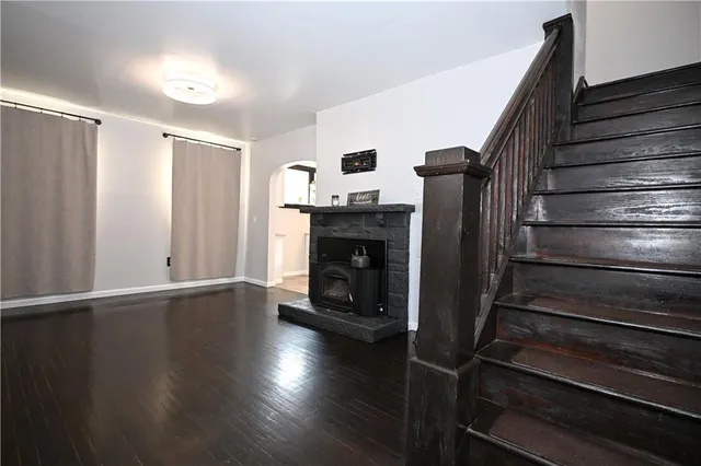 a view of an entryway with wooden floor