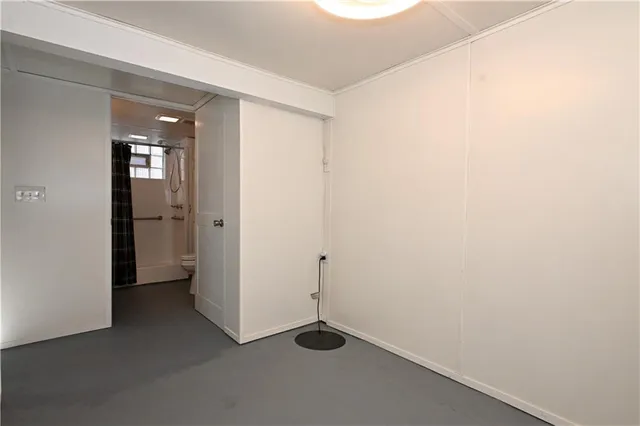 a bathroom with a toilet and shower