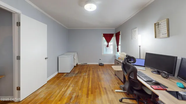 a bedroom with bed and a window