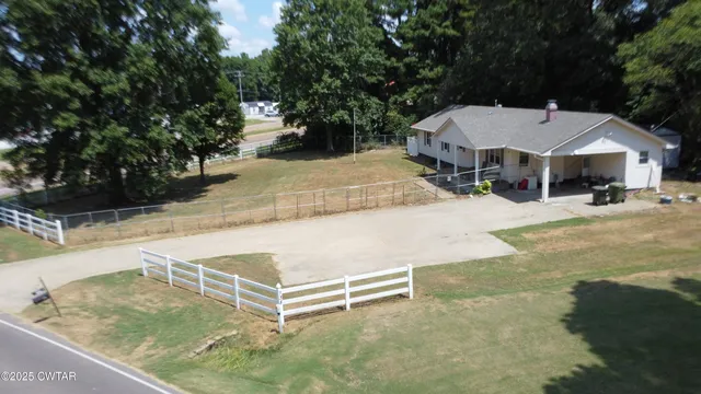 a view of a backyard with a patio