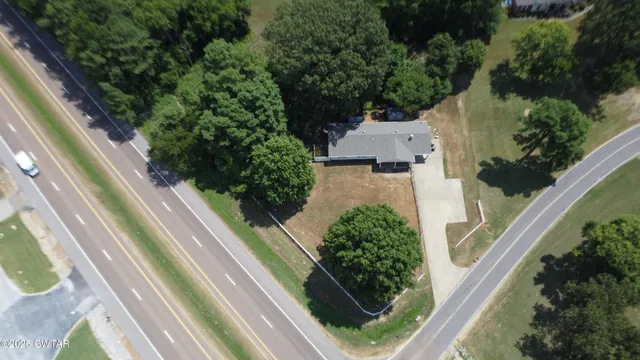an aerial view of house with a yard