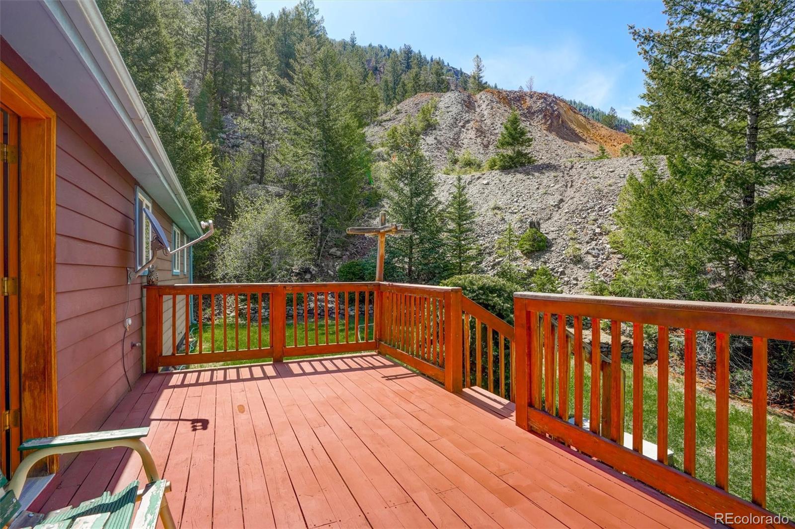 1206 Biddle Street Georgetown, CO 80444 - Photo 26 of 32 a view of balcony with wooden floor and fence