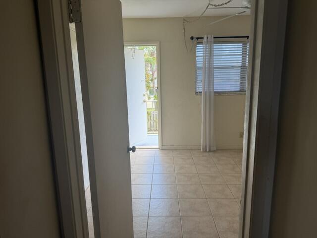 660 Glouchester Street, Unit 206 Boca Raton, FL 33487 - Photo 11 of 13 a view of an empty room with windows and closet