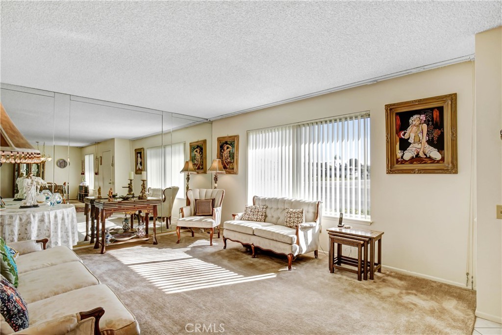 26490 McCall Boulevard Menifee, CA 92586 - Photo 2 of 14 a living room with furniture and a large window