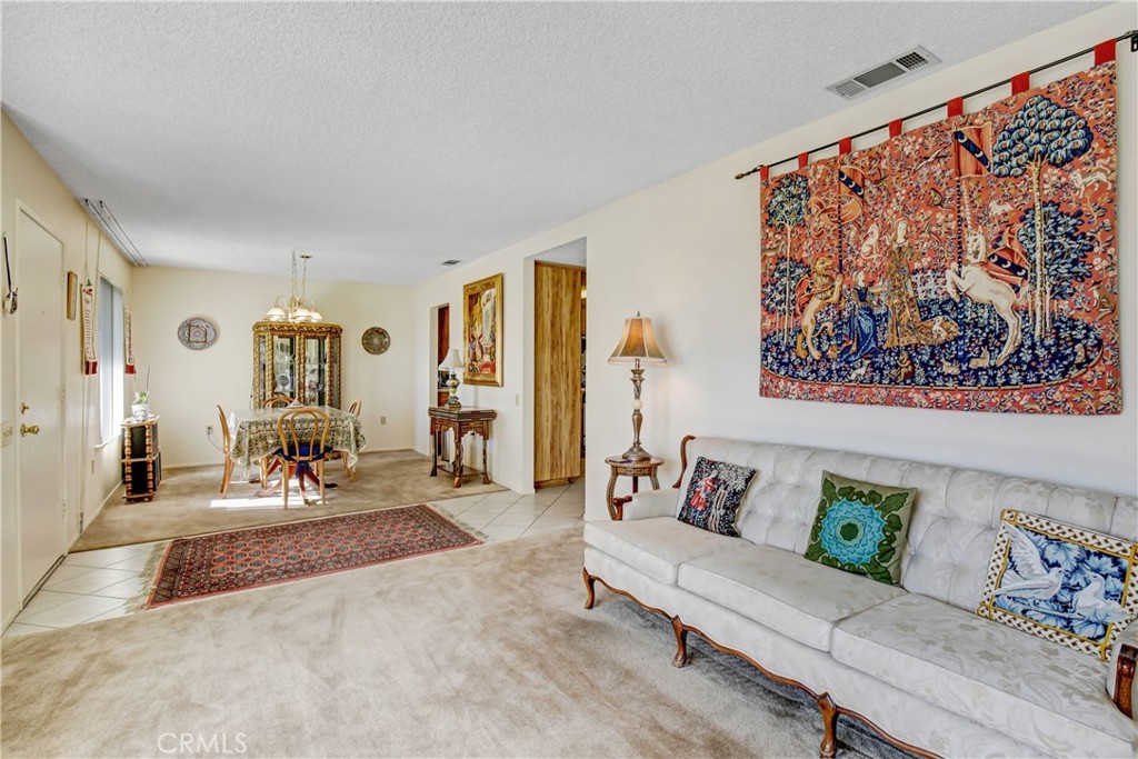 26490 McCall Boulevard Menifee, CA 92586 - Photo 3 of 14 a living room with furniture and wooden floor