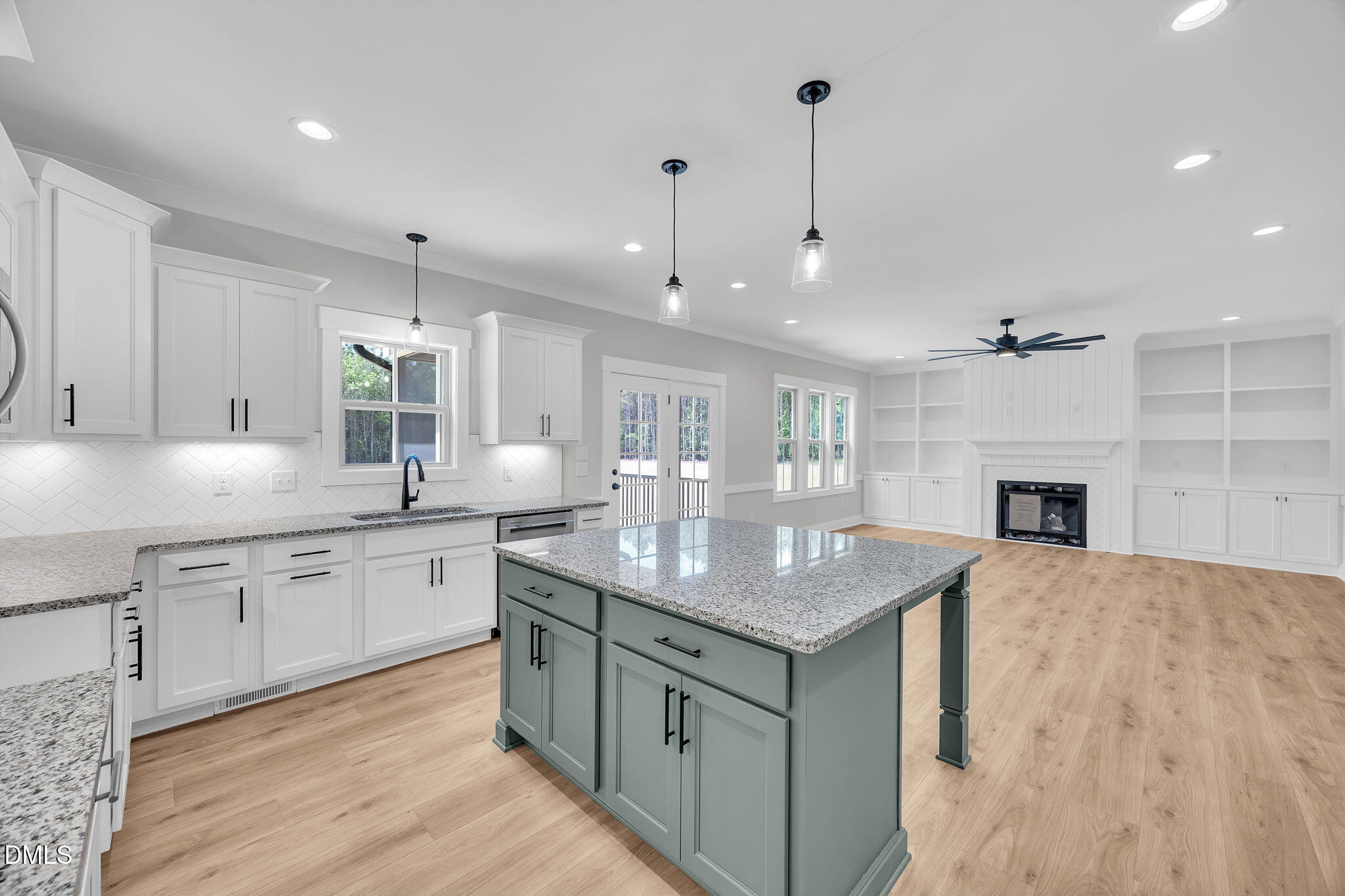 378 Freedom Ridge Drive Smithfield, NC 27577 - Photo 14 of 33 a kitchen with a sink chandelier and wooden floor
