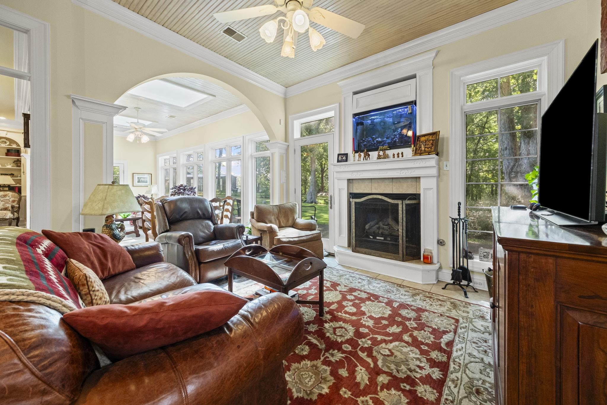 450 Cherry Road Eads, TN 38028 - Photo 12 of 24 a living room with furniture a flat screen tv and a fireplace