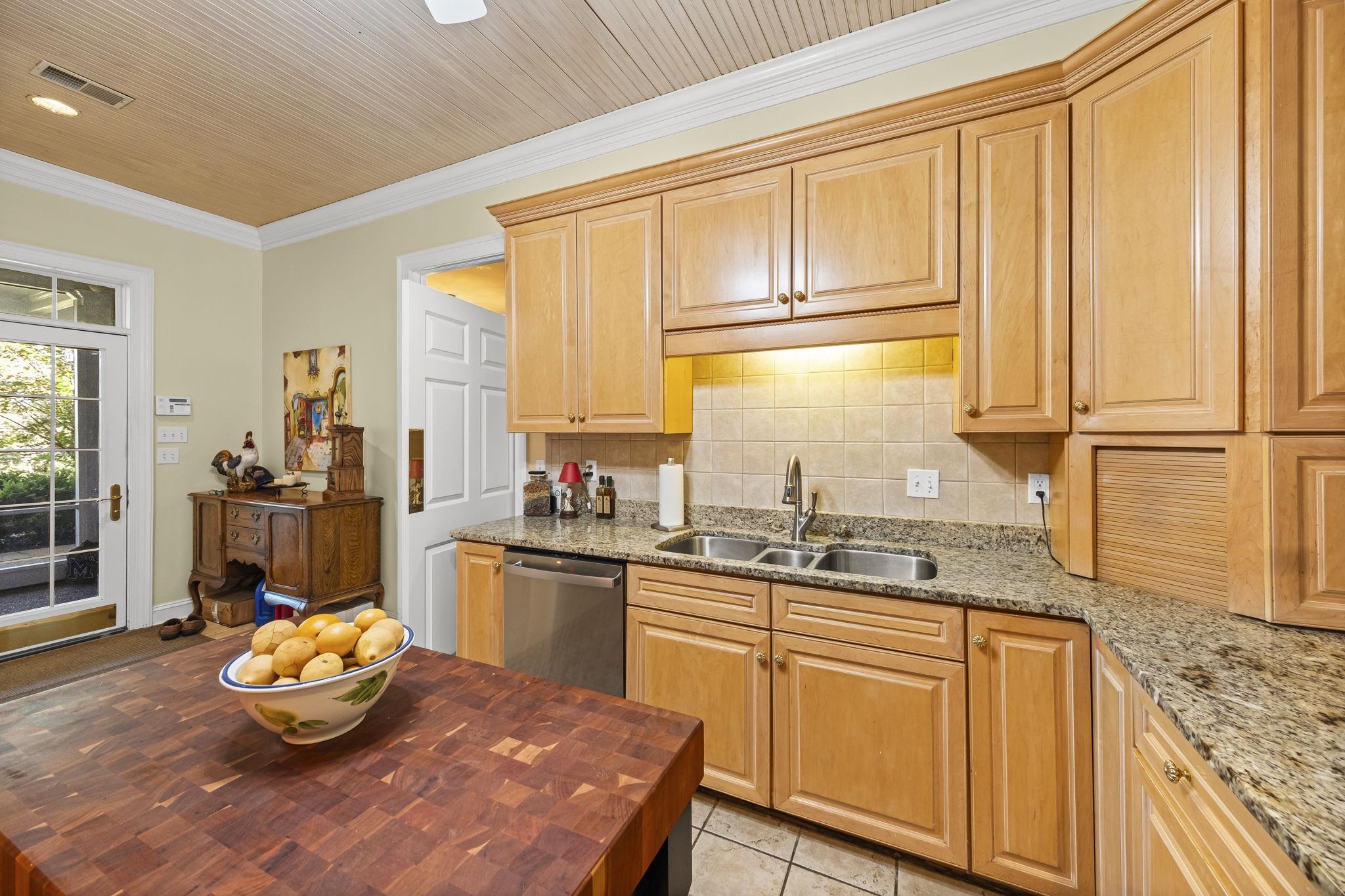 450 Cherry Road Eads, TN 38028 - Photo 13 of 24 a kitchen with stainless steel appliances granite countertop a stove a sink and a refrigerator