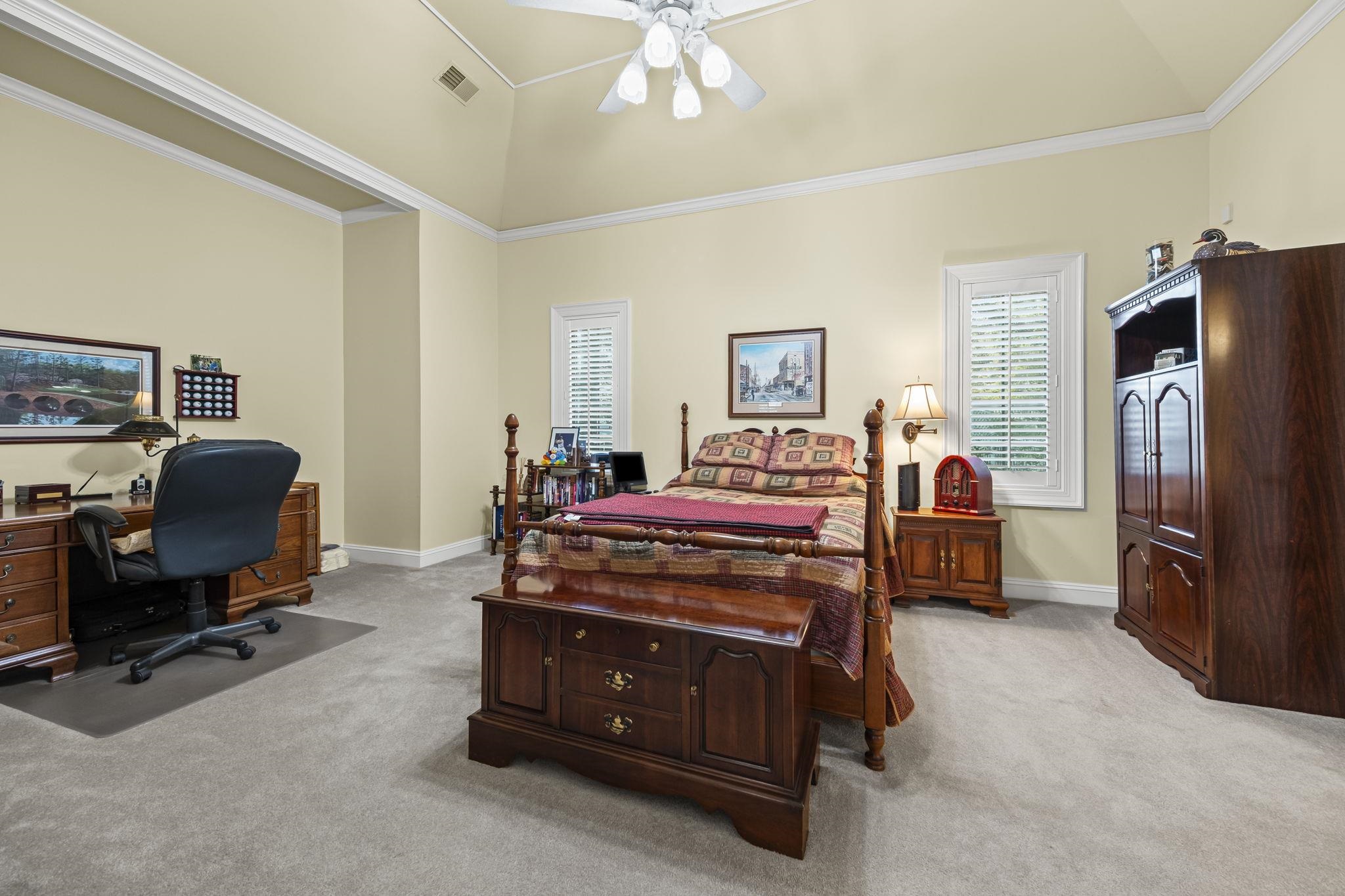 450 Cherry Road Eads, TN 38028 - Photo 16 of 24 a bedroom with bed and a chandelier