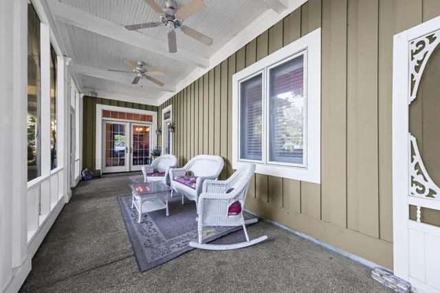 a living room with furniture and windows