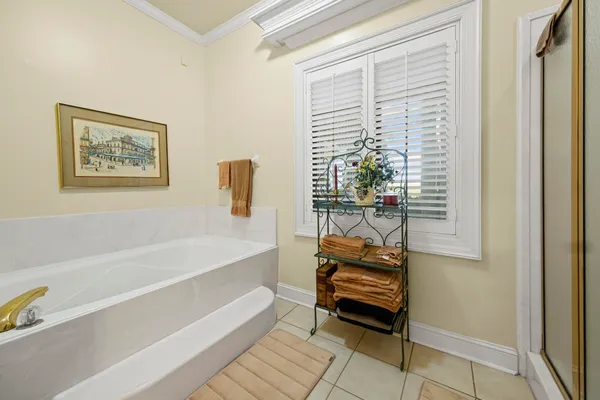 a bathroom with a bathtub and a window