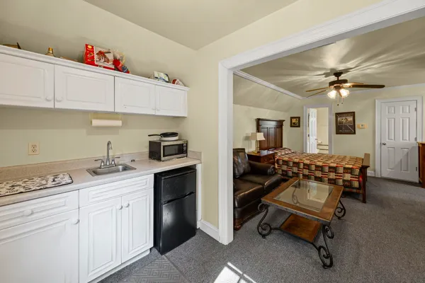 a kitchen with a sink cabinets and window