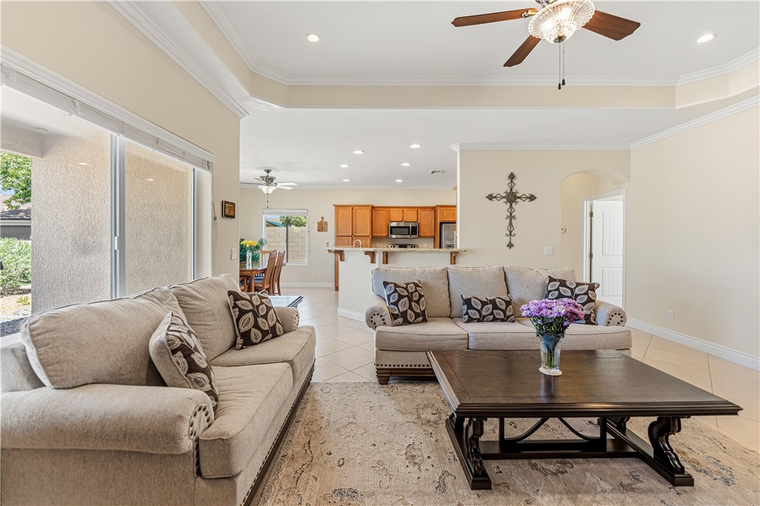3315 Rainbow Mine Road Kingman, AZ 86401 - Photo 10 of 54 Living area featuring a ceiling fan, recessed lighting, and crown molding