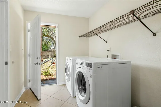a utility room with dryer and washer