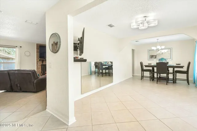 a view of a livingroom with furniture and window