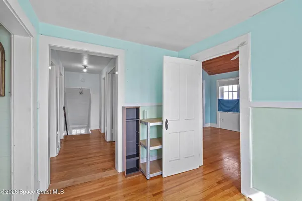 a view of entryway with wooden floor