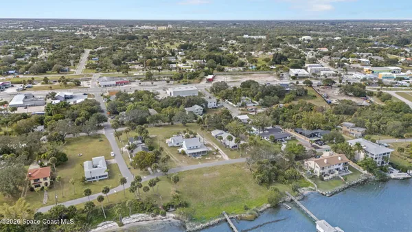 an aerial view of a house with a lake view