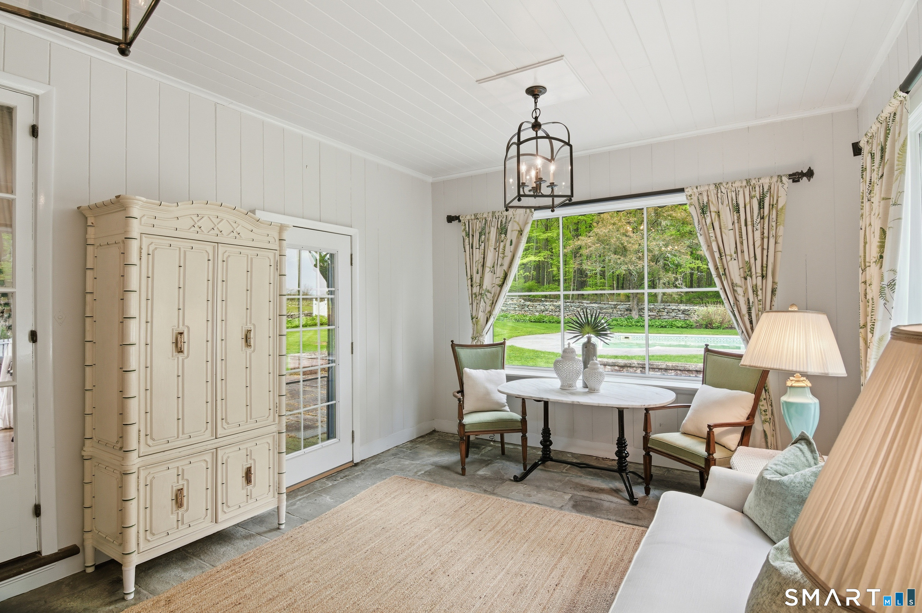 433 Wrights Crossing Road Pomfret, CT 06259 - Photo 11 of 36 All-season sunroom providing beautiful pool vistas, perfect for unwinding any time.