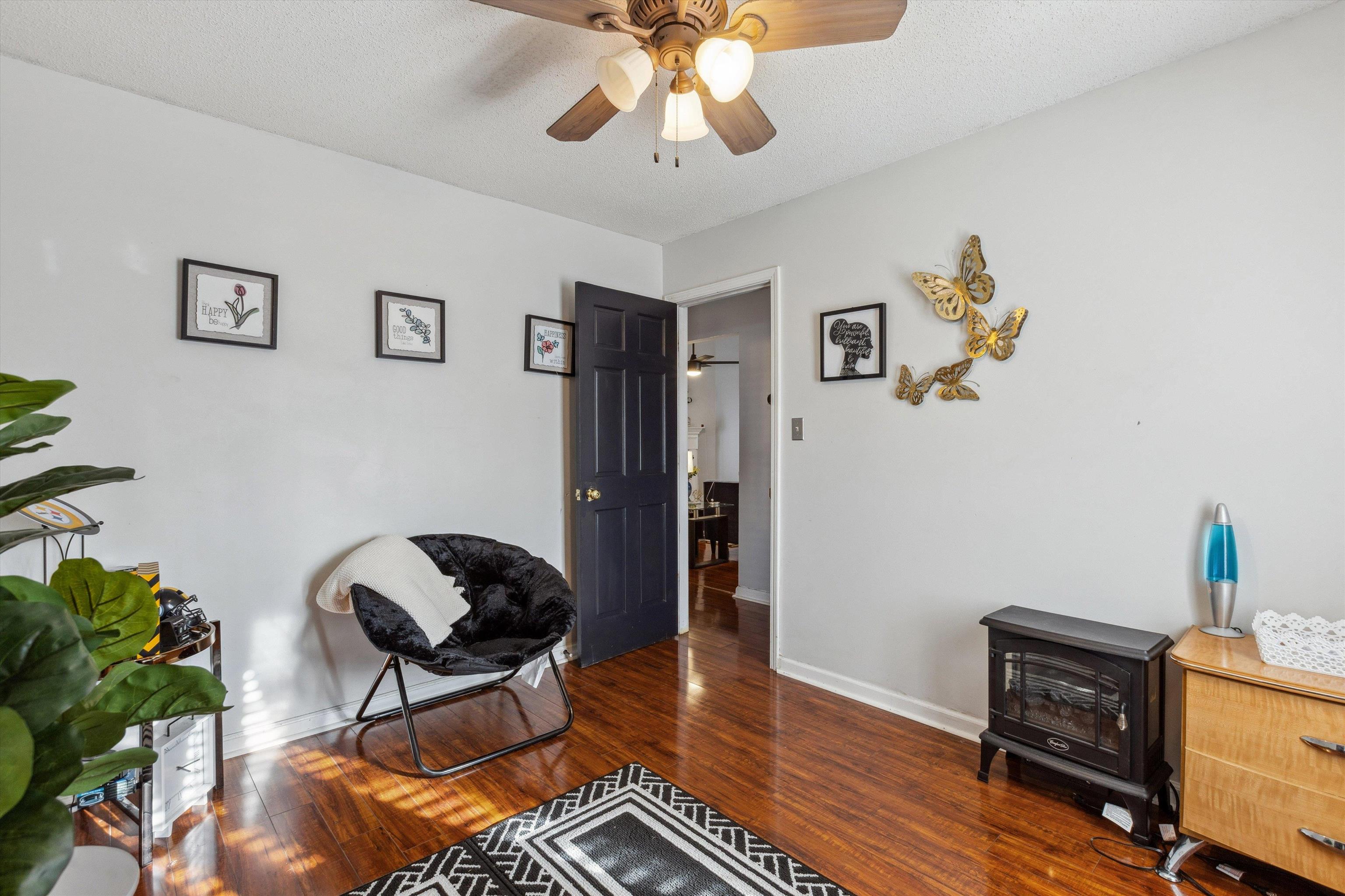 4120 Long Creek Road Memphis, TN 38125 - Photo 19 of 26 Bedroom ft. a ceiling fan, wood floors and a walk-in closet