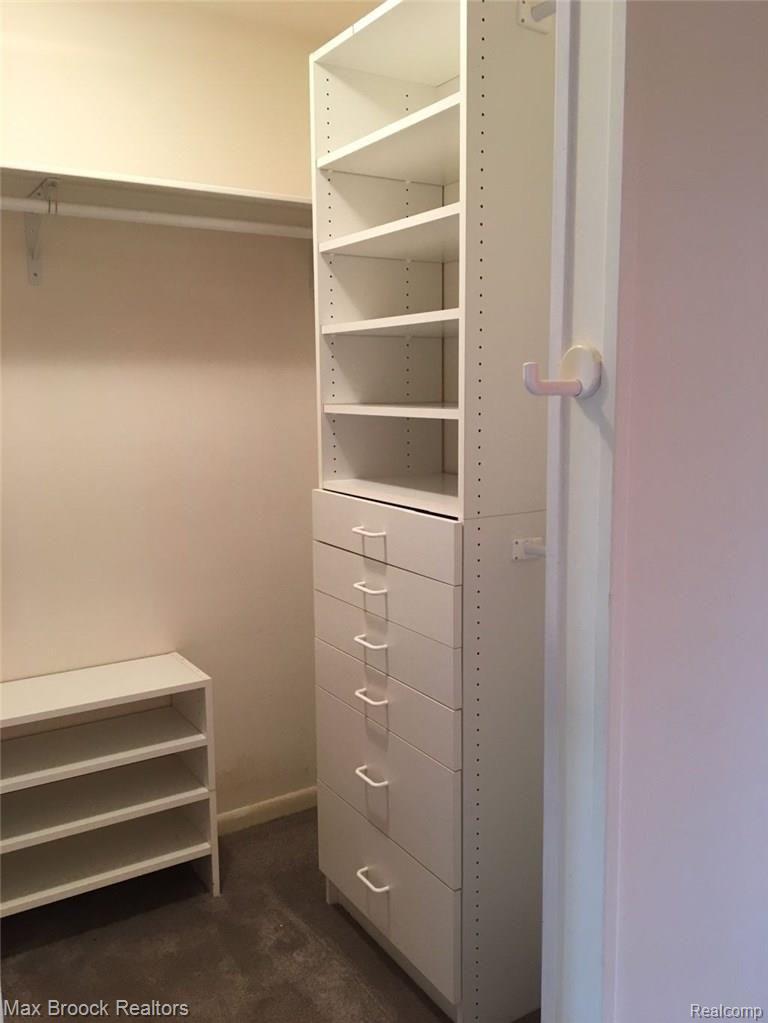 3404 Adams Road Troy, MI 48084 - Photo 16 of 27 GREAT ORGANIZERS IN THE MASTER SUITE CLOSET WITH ADJUSTABLE SHELVING.