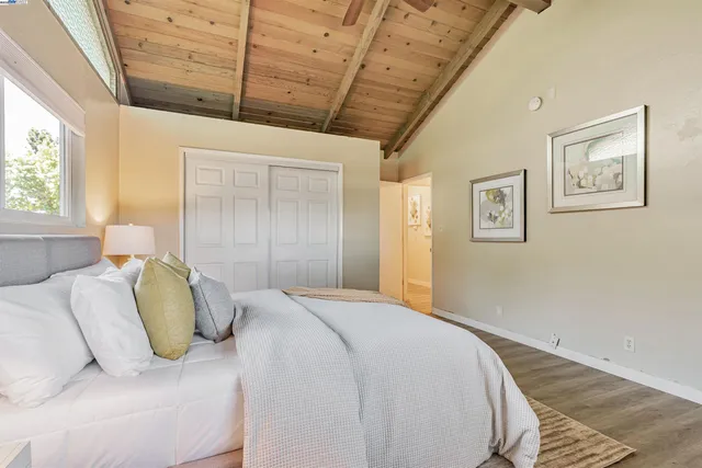 a bedroom with a bed and with furniture