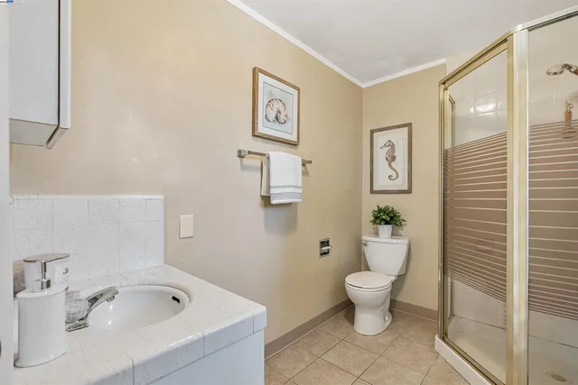 a bathroom with a sink a mirror and a shower