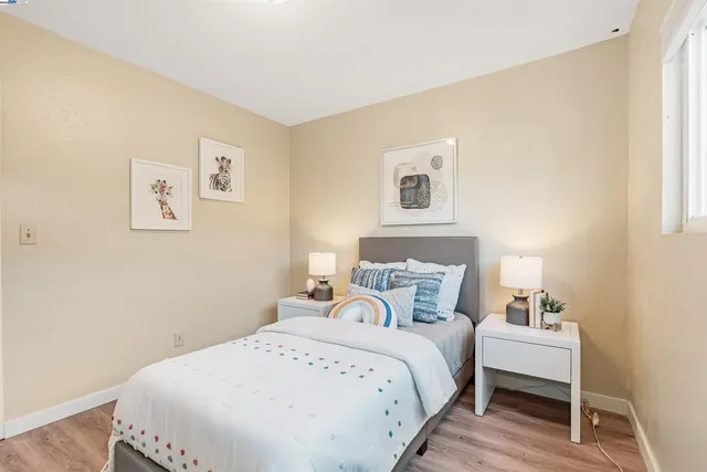 a bedroom with a bed and a table