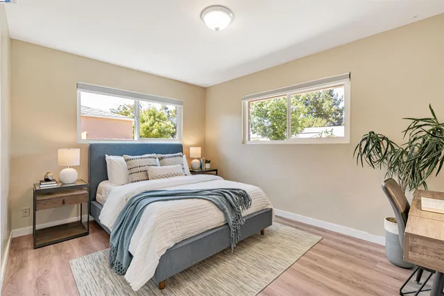 a bedroom with a bed and window