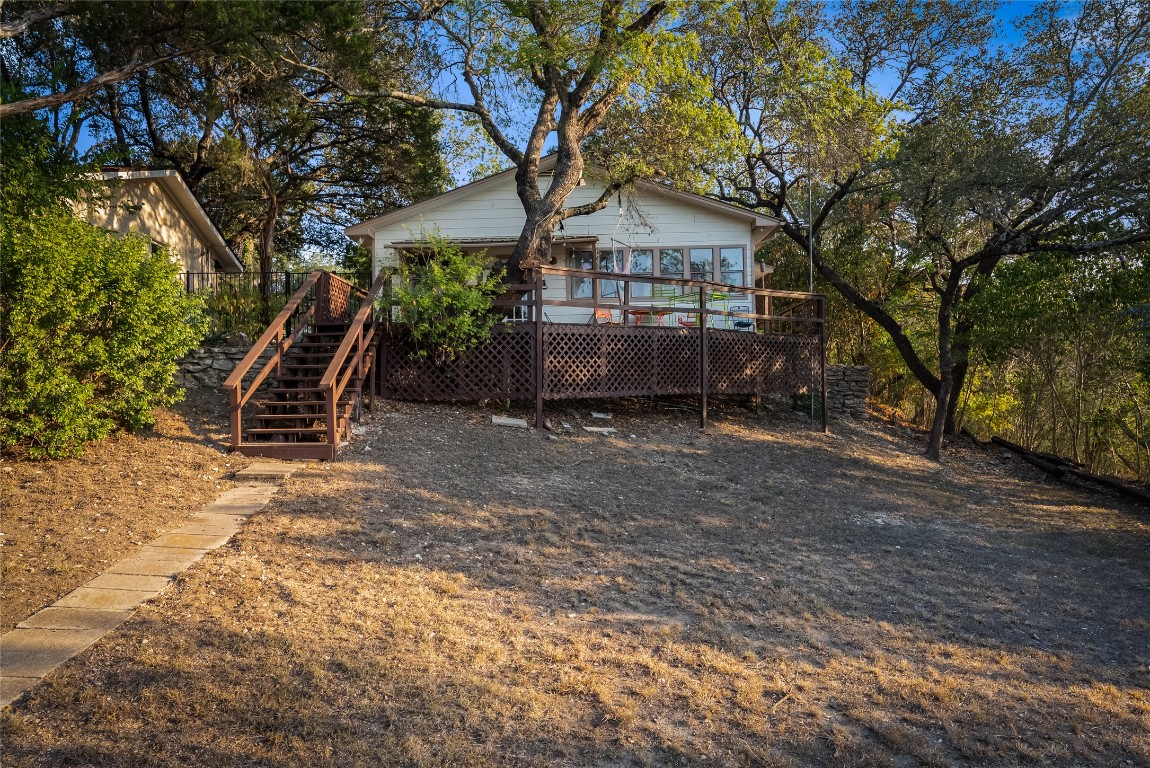 16020 Pool Canyon Road Austin, TX 78734 - Photo 12 of 29 a view of a bench in backyard of house